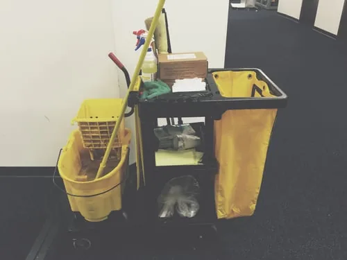 Commercial janitorial cart stocked and ready for an office cleaning route