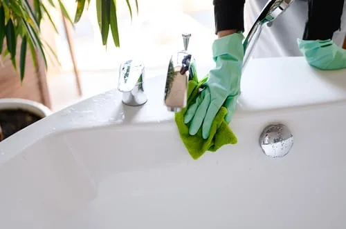 CH Cleaning technician deep cleaning a bathroom sink in a Eureka home